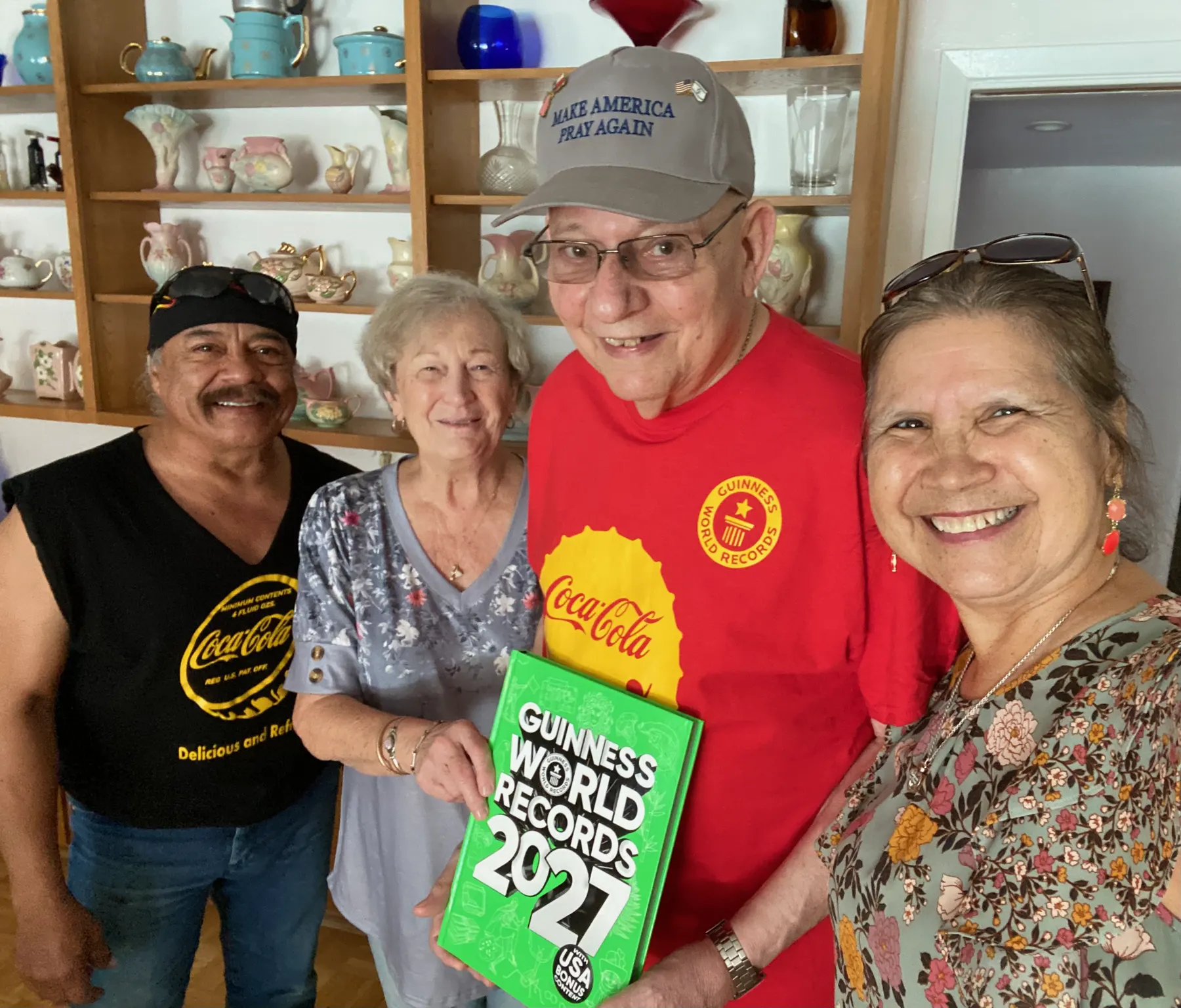Bardo and Olga Cuellar with their friends Ron and Sue, who hold a dedicated copy of Guinness World Records 2027