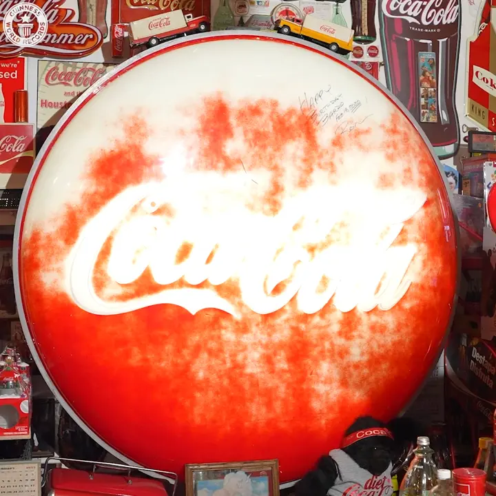 The light-up Coca-Cola button in the Cuellar collection, from the Guinness World Records Facebook video