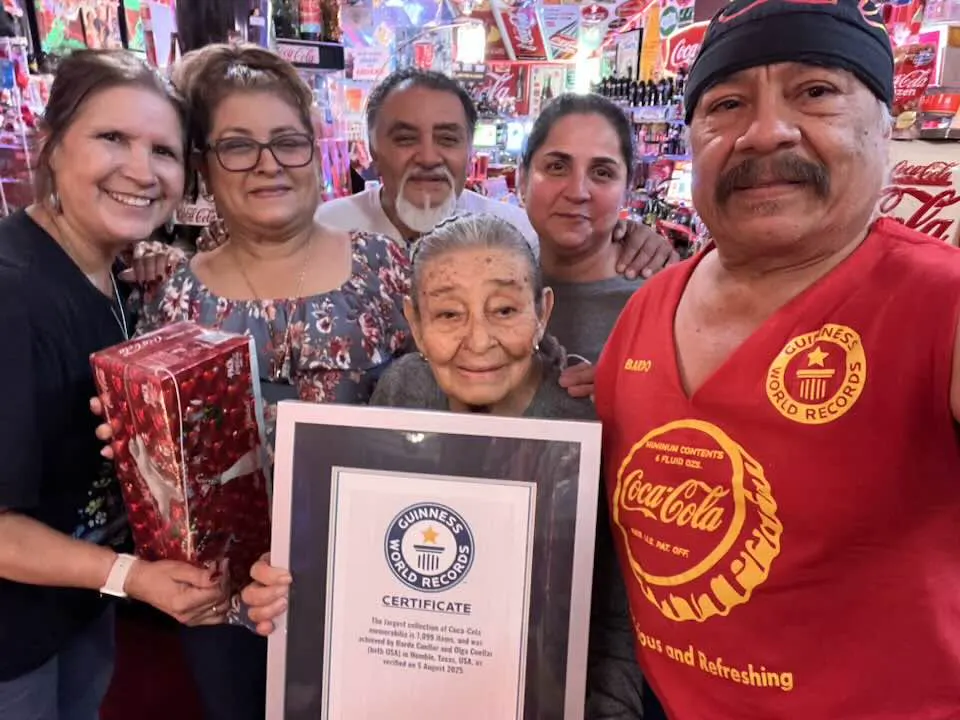Chuy, Nancy, Chuy's sister and his mom visiting the Coca-Cola room with Bardo and Olga, holding the Guinness World Records certificate