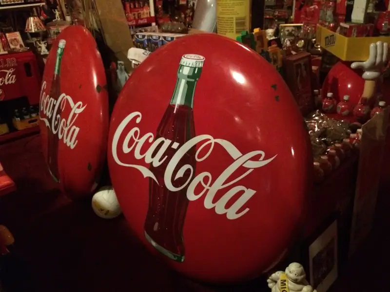 Vintage red Coca-Cola button signs