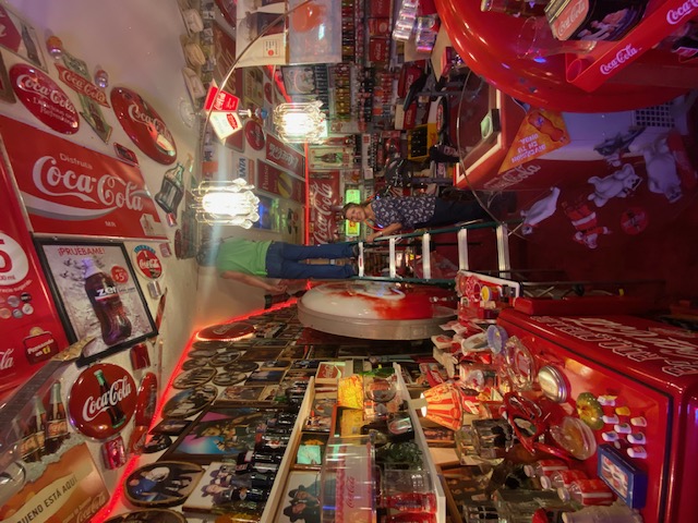 Assorted Coca-Cola sticker lot on wall